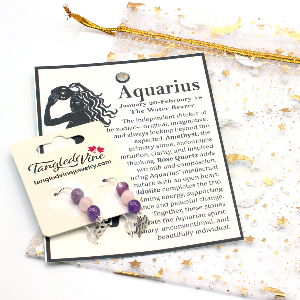 Express the individual spirit of Aquarius with earrings featuring Amethyst, Rose Quartz, and Lepidolite—a gemstone trio symbolizing vision, compassion, and balance.