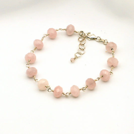 Pink Rose Quartz Gemstones carefully arranged with top-grade sterling silver to create a delicate chain with a lobster clasp closure.