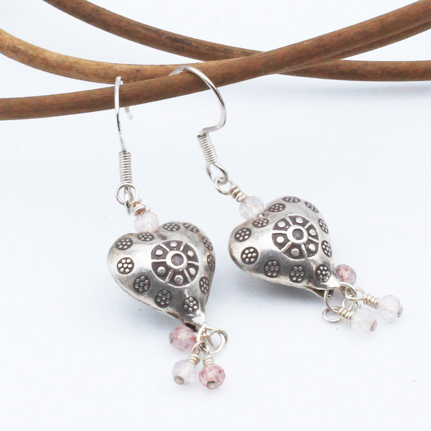 Sweet Rose'- Earrings, Heart-shaped Sterling Silver focal with Rose Quartz gemstones. These earrings are finished with sterling silver lever-back ear wires.