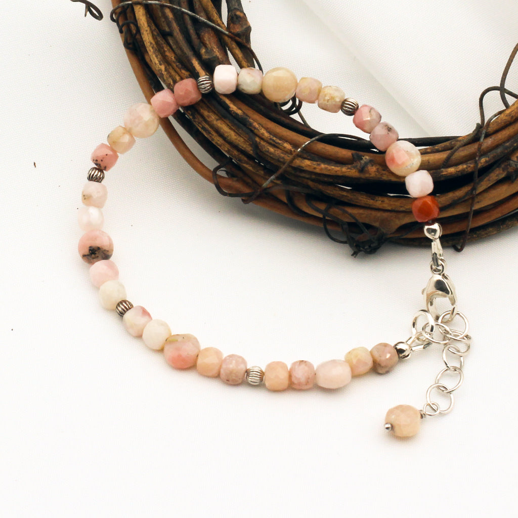 Handcrafted with faceted Pink Opal Gemstones. Sterling Silver adjustable chain and lobster claw clasp.