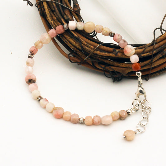 Handcrafted with faceted Pink Opal Gemstones. Sterling Silver adjustable chain and lobster claw clasp.