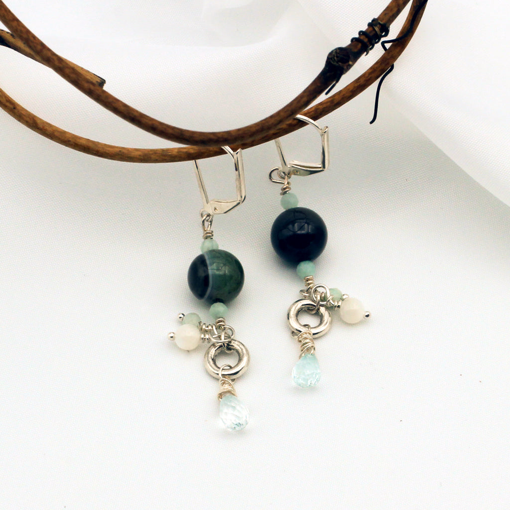 Agate, Amazonite, Aquamarine, and Mother of Pearl Gemstones dangle from a Pewter focal on Silver Electroplated Lever-back Ear-wires.