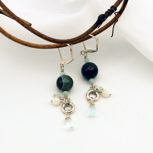 Agate, Amazonite, Aquamarine, and Mother of Pearl Gemstones dangle from a Pewter focal on Silver Electroplated Lever-back Ear-wires.