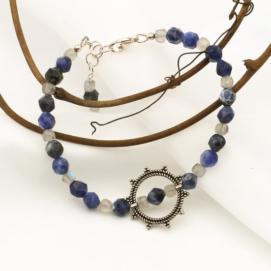 Sodalite and Labradorite Gemstones surrounding a Sterling Silver Sunburst, finished with  Sterling Silver Adjustable Chain and Lobster Claw clasp.