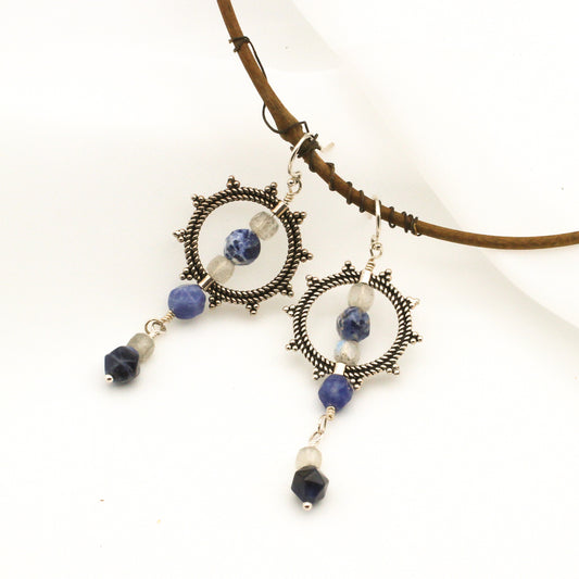 Handcrafted earrings with Sodalite and Labradorite Gemstones surround a Sterling Silver Sunburst, finished with Sterling Silver French Hook Ear-wires.