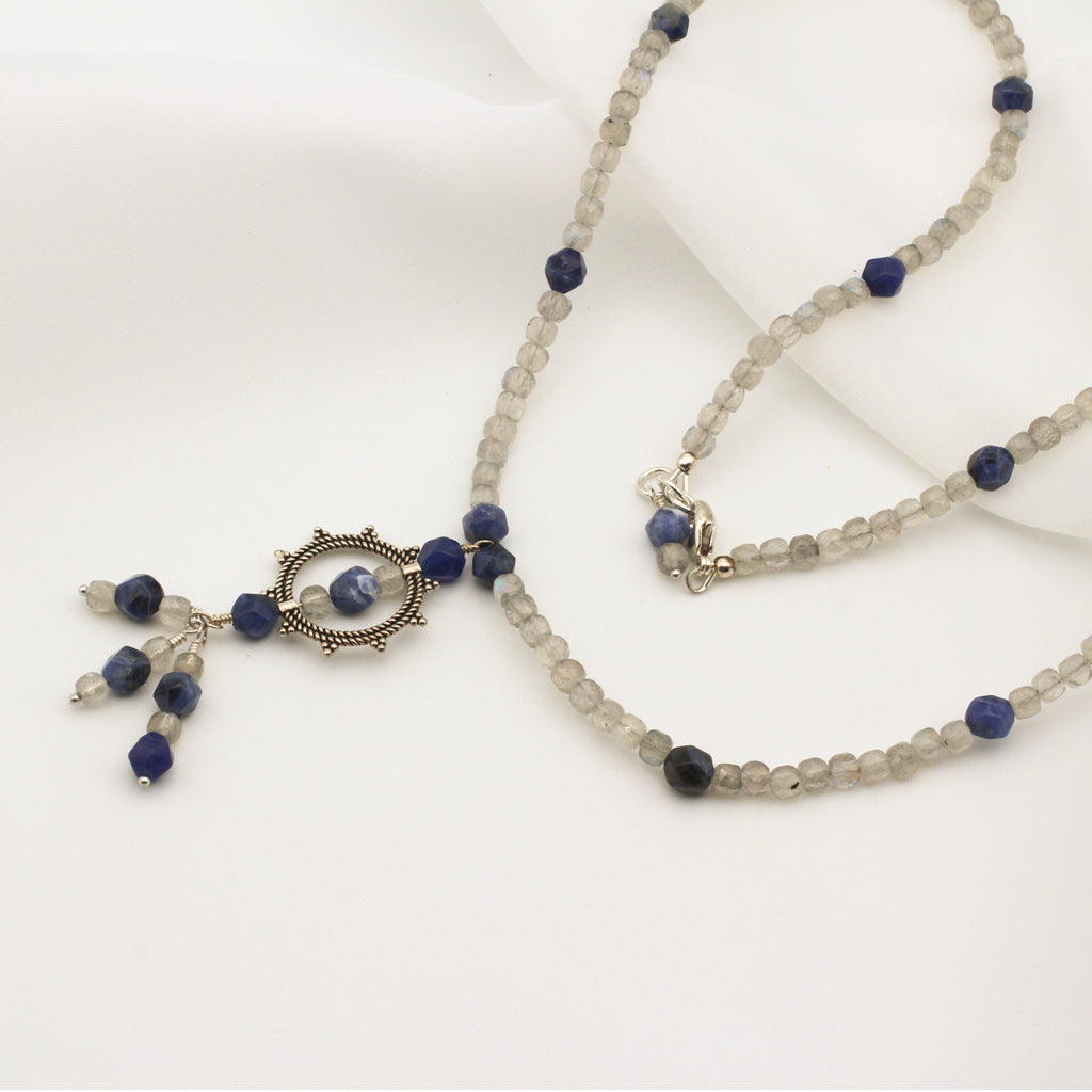 Muse - Necklace, Sodalite and Labradorite Gemstones surround a Sterling Silver Sunburst and finished with a Sterling Silver Lobster Claw clasp.