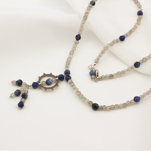 Muse - Necklace, Sodalite and Labradorite Gemstones surround a Sterling Silver Sunburst and finished with a Sterling Silver Lobster Claw clasp.