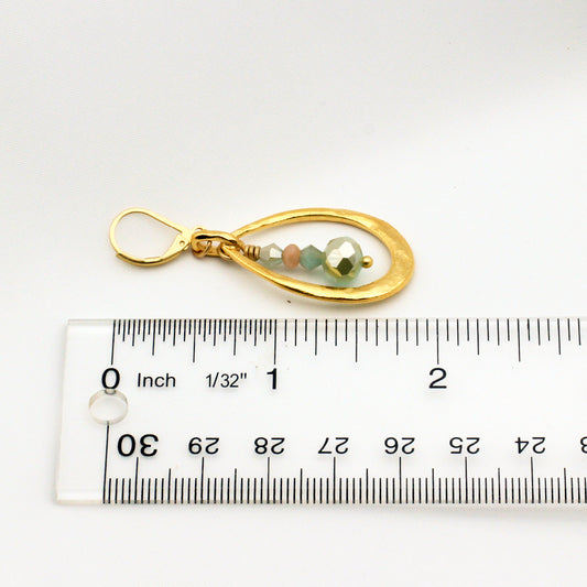 Matte gold hoops with mint green crystals and sunstone gemstones; 2-inch length with secure leverback ear wires.