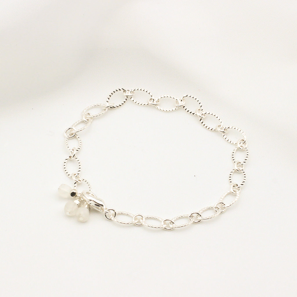 Elegant bracelet with moonstone cubes on silver electroplated chain.