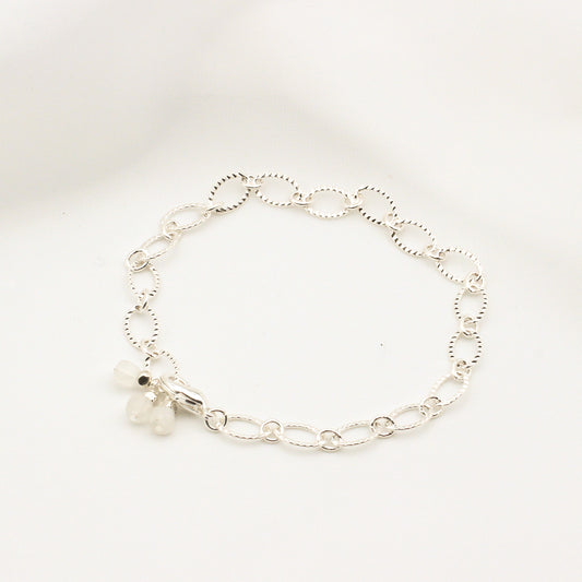 Elegant bracelet with moonstone cubes on silver electroplated chain.