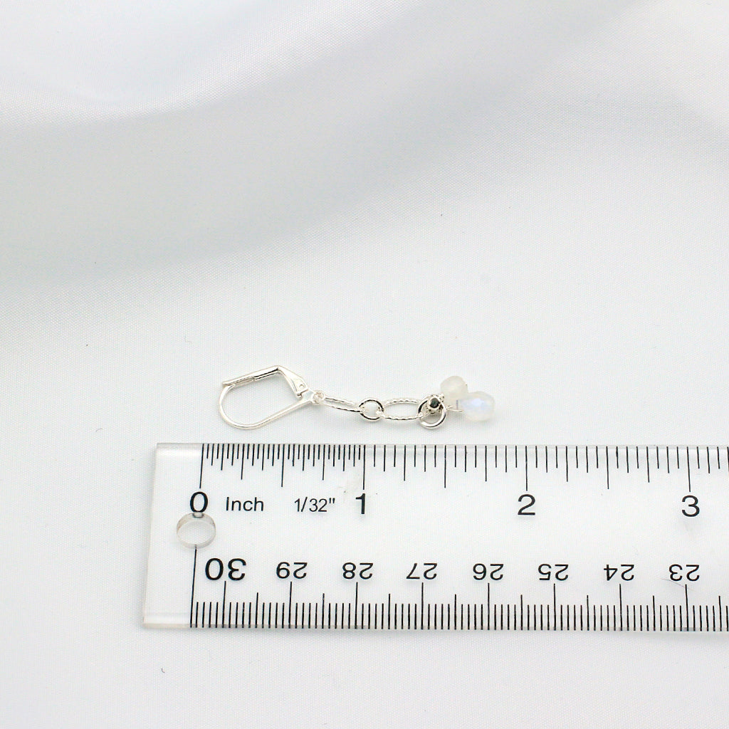 Moonstone cube earrings on silver chain with lever-back ear-wires.