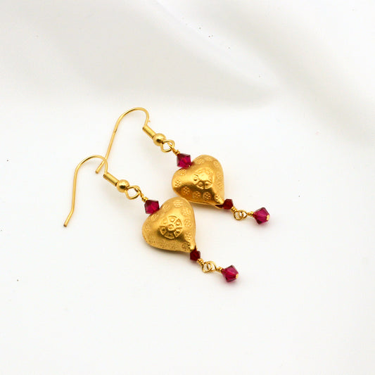 Gold vermeil heart earrings with ruby crystal bi-cone dangles.