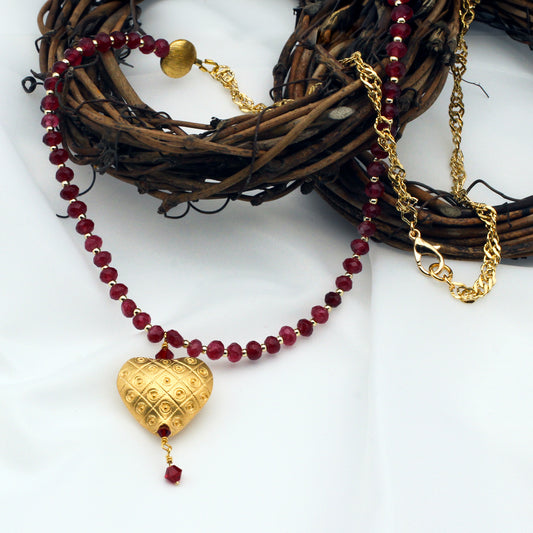 Gold vermeil heart necklace with red jade and ruby crystal accents.