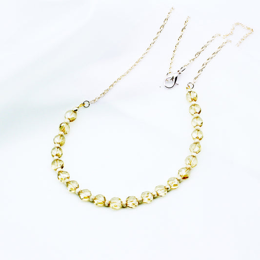 This finely crafted necklace showcases radiant champagne-hued Crystals paired with polished sterling silver accents. Finished with a reliable lobster claw clasp.
