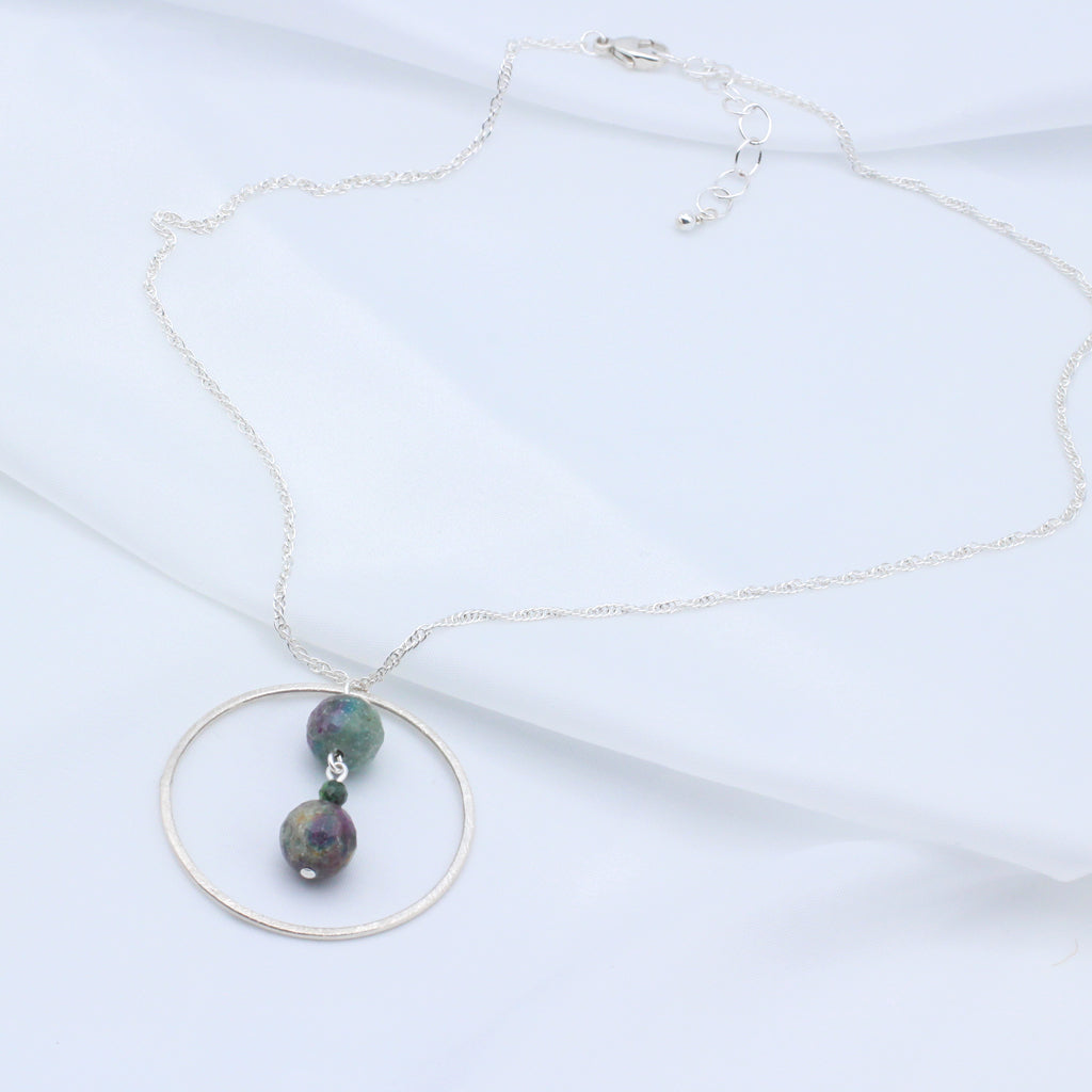 Handcrafted from natural Ruby Zoisite gemstones and sterling silver, the necklace measures 18 inches long with 2" extender and Lobster Clasp Closure.