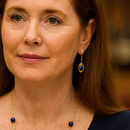 These Lapis Lazuli and gold earrings capture the serene charm of a vineyard breeze.