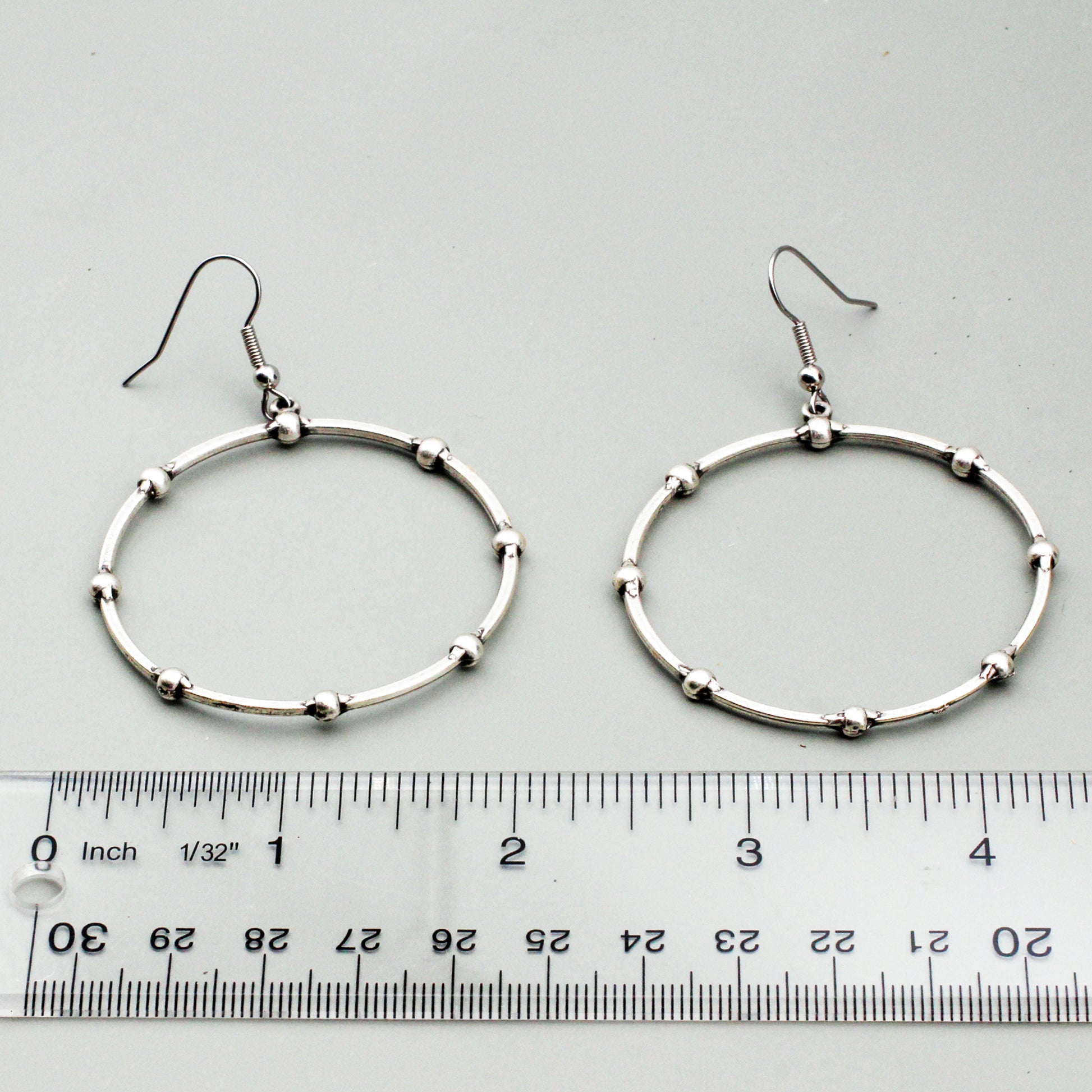 A textured Pewter and Silver-electroplated hoop design.