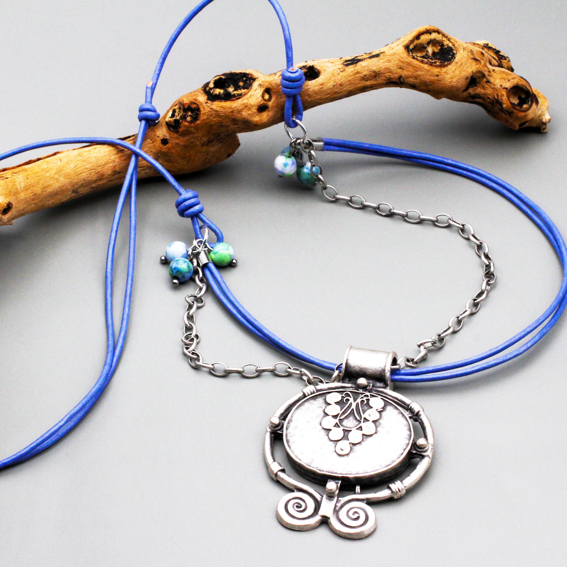 Adjustable necklace features a grape-inspired focal on a trendy leather cord. Adjust it to your preferred length and unleash your inner fashionista.