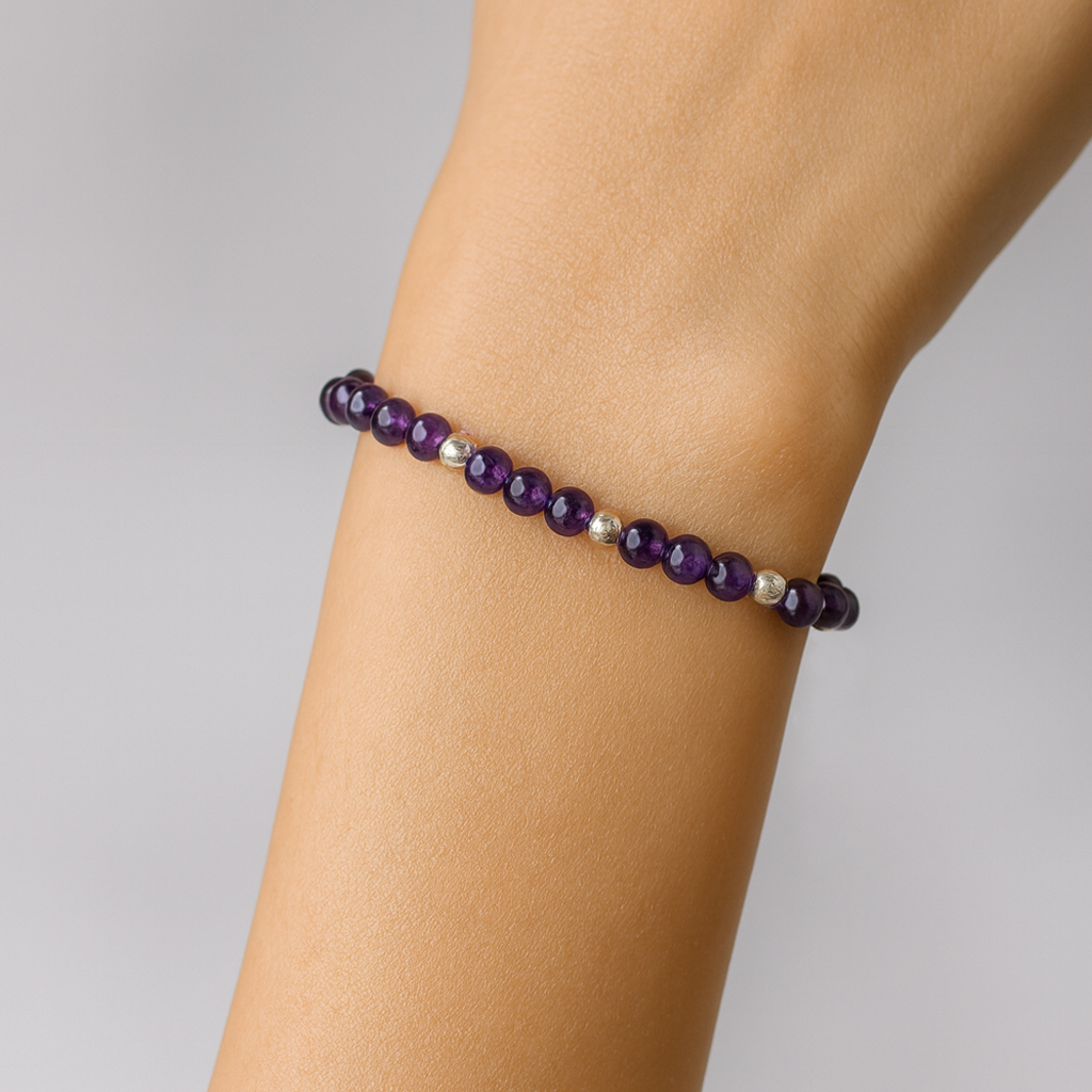 Bracelet features a stunning blend of Amethyst gemstones paired with Pewter spacer beads. Its elastic construction ensures a flexible and comfortable fit.
