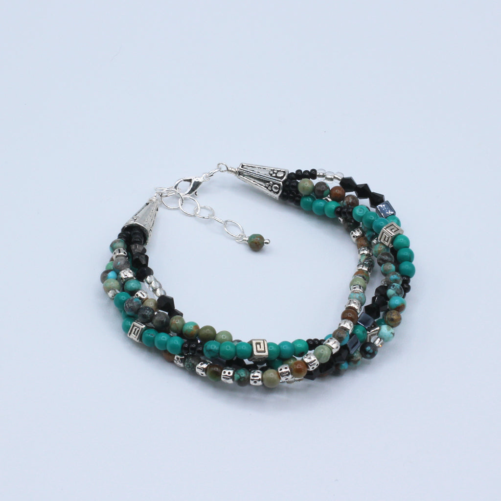 This multi 4 layer bracelet, adjustable from 6 1/2" to 7 1/2" with a chain extender,