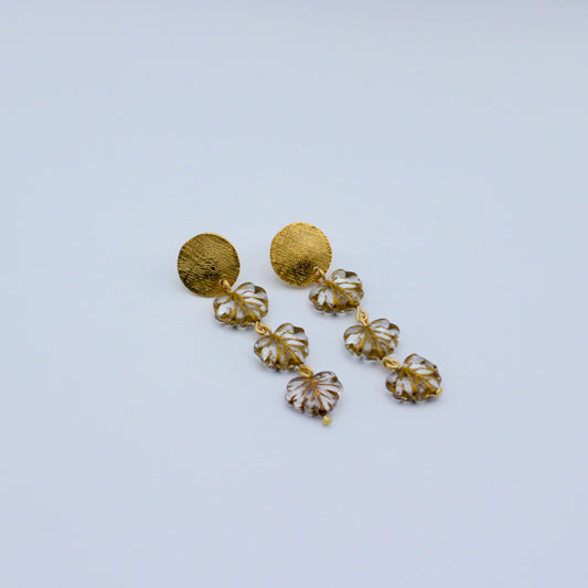 These sophisticated earrings feature a trio of luminous leaves suspended from a meticulously textured round post.