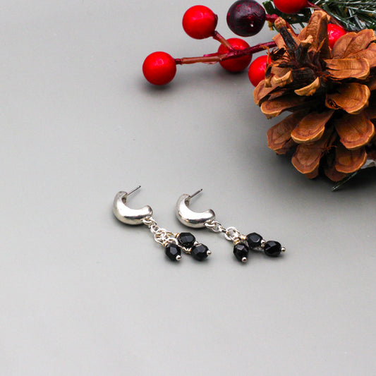 Silver metals and elegant black Czech beads adds depth and dimension to the design. Finished with stylish post-style ear-wires.