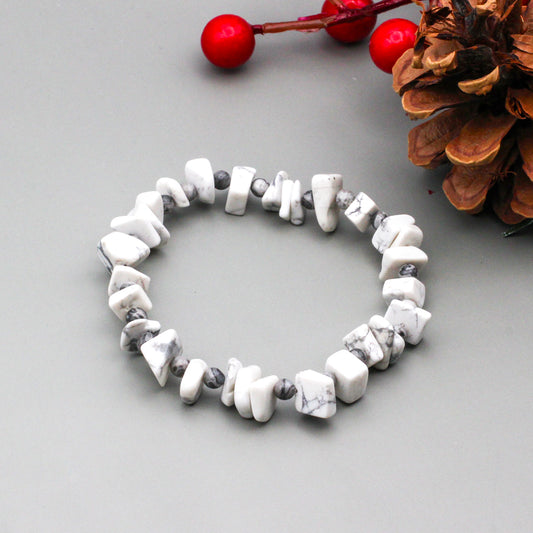 Howlite abstract nuggets surrounded by Picasso Jasper beads on a stretchy elastic cord.