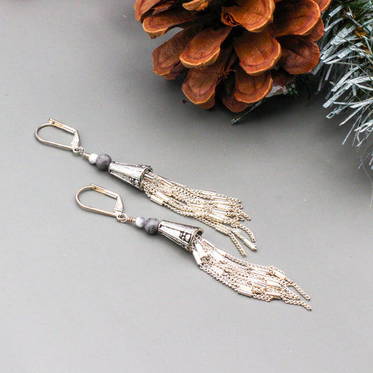 Howlite and Picasso Jasper beads and a decorative cone with beaded chain fringe.