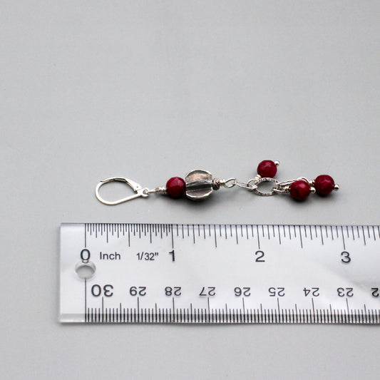 Dangle earrings showcase a combination of Faceted Agate Gemstones and a Sterling Silver chain, highlighted by a textured centerpiece. Completed with secure lever-back ear wires.