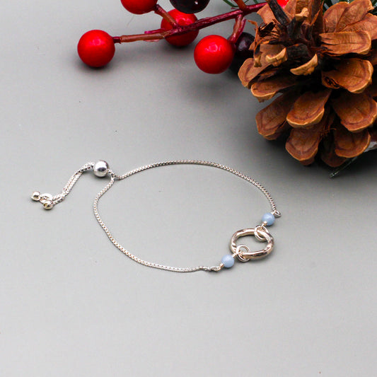 Angelite Gemstone and iridescent Moonstones, accented by high-quality sterling silver metals.