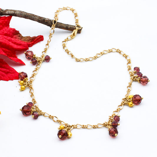 Matte gold chain with clusters of sparkling crystal beads and textured round beads.