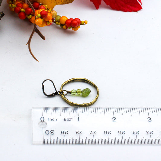 Hoop earring, featuring peridot gemstones with antique bronze lever-back ear-wires.
