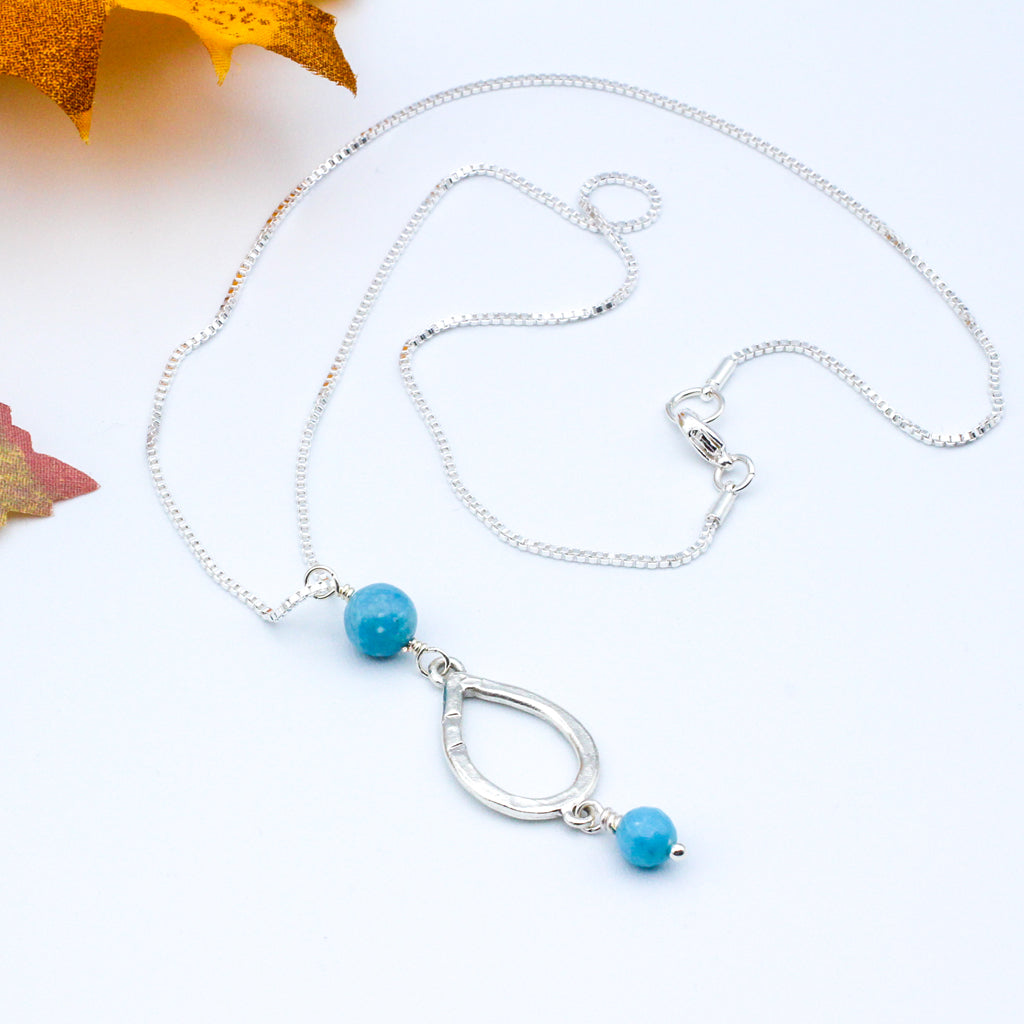 Stunning Larimar Gemstones. The teardrop pendant gracefully moves along the delicate chain.