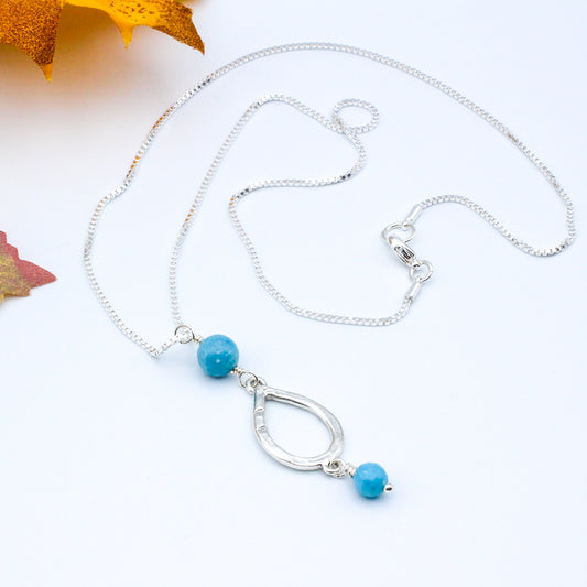 Stunning Larimar Gemstones. The teardrop pendant gracefully moves along the delicate chain.