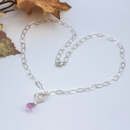 The necklace features Pink Quartz Faceted Briolette hanging delicately from a triple loop Sterling Silver Rosette on a delicate Sterling  Silver Chain.
