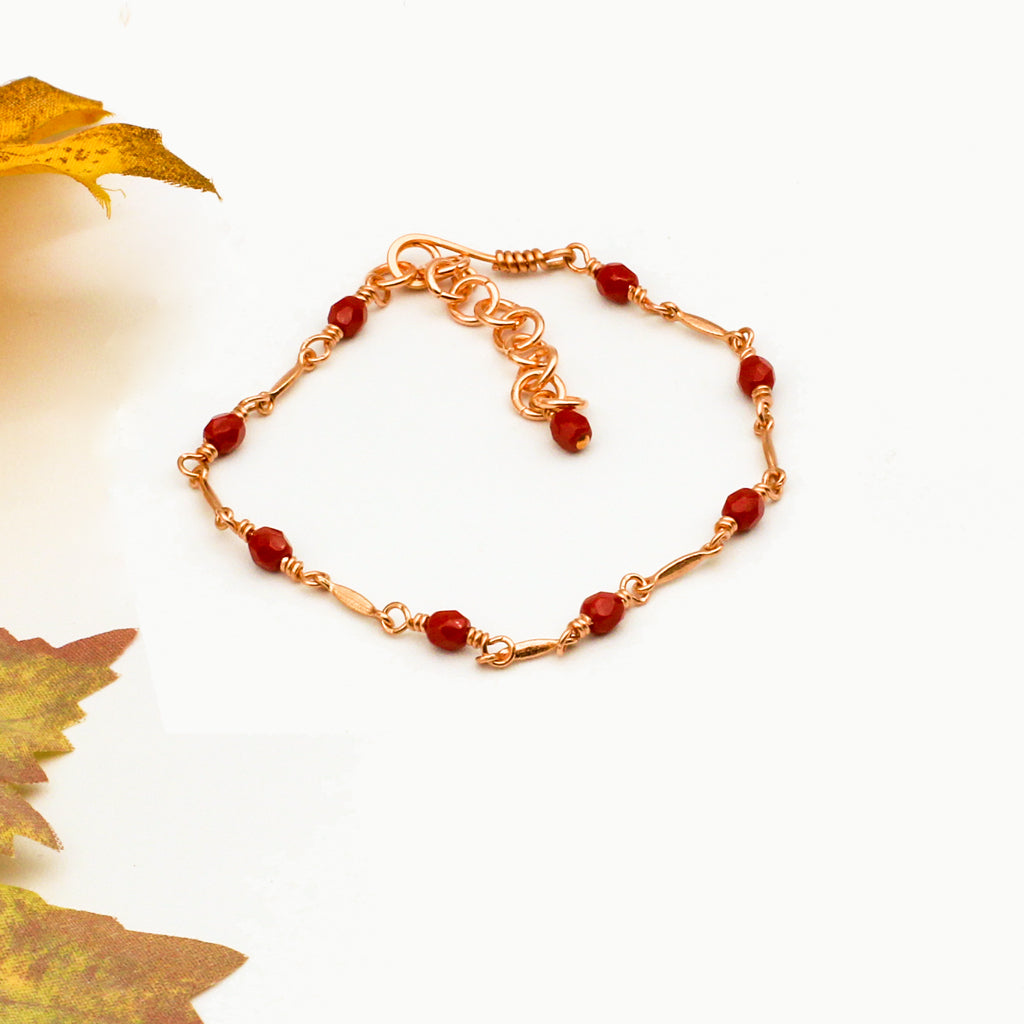 A combination of deep faceted crystals and jeweler's copper metals.