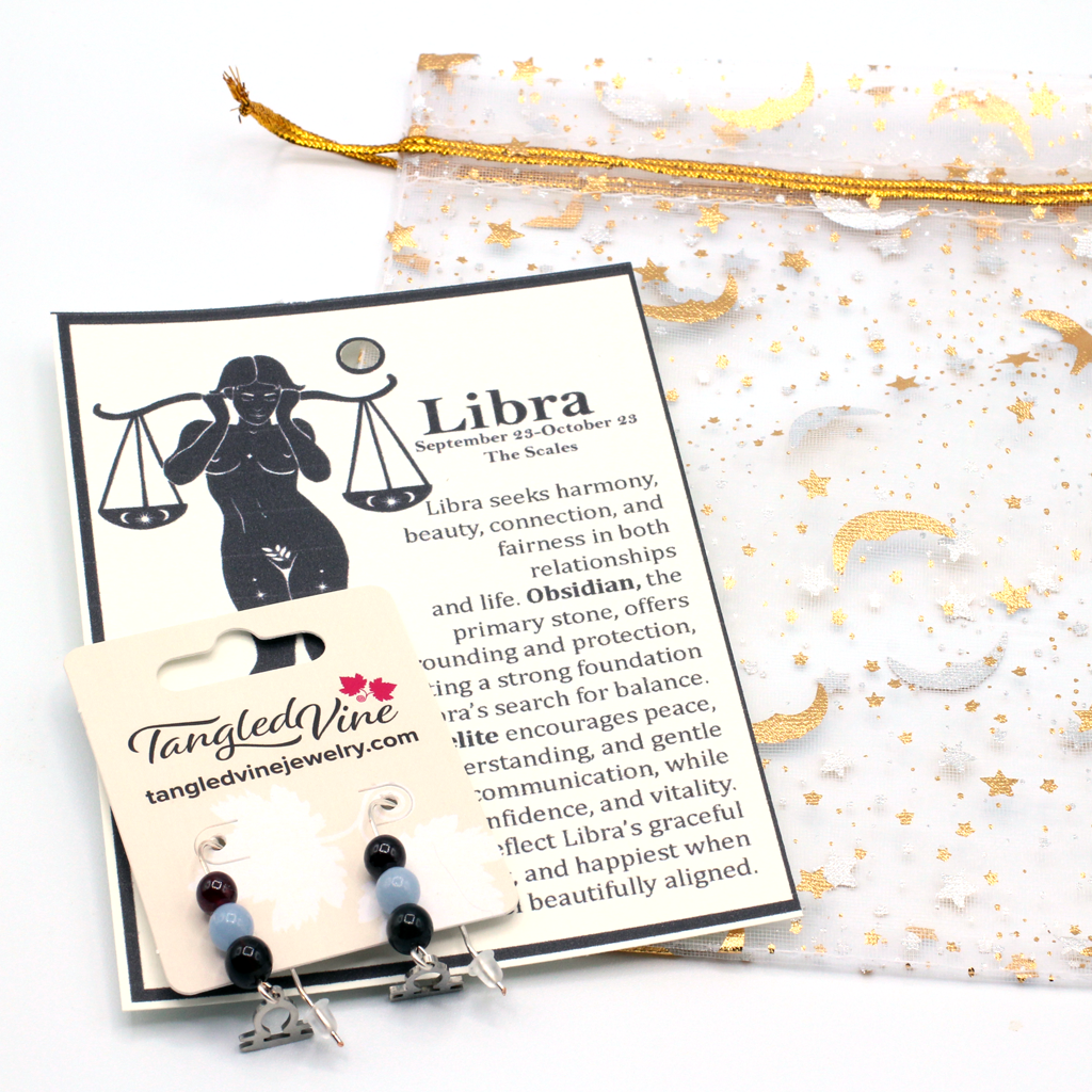 Celebrate the graceful spirit of Libra with earrings featuring Obsidian, Angelite, and Garnet—a distinctive gemstone trio symbolizing balance, peace, and passion.Finished with a Libra symbolic charm and suspended from a hand-forged earwire.