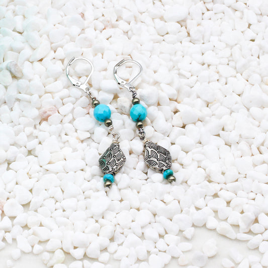 Decorative Pewter adornments, paired with Heishi, faceted round Turquoise, and Pyrite gemstones, make these earrings a perfect complement to a southwestern ensemble.