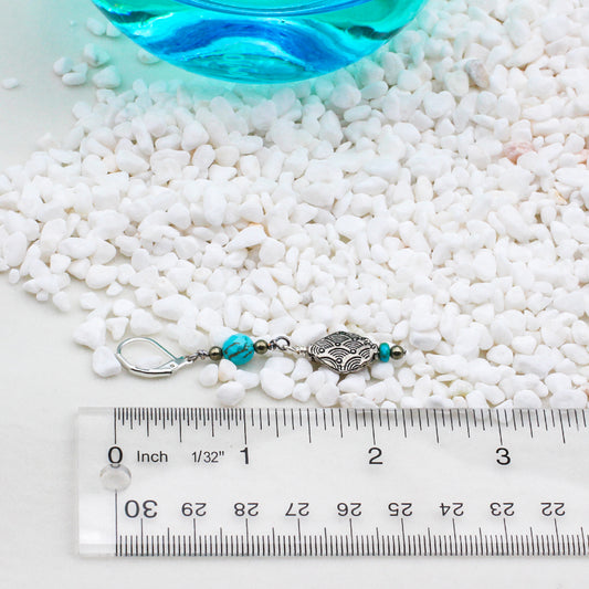 Decorative Pewter adornments, paired with Heishi, faceted round Turquoise, and Pyrite gemstones, make these earrings a perfect complement to a southwestern ensemble.