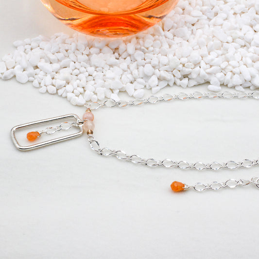 Silver Etched Rectangle Focal, Mellon Jade Briolette and sparkling crystals, accented with beautiful Flower Madagascar Agate. It is completed with a chain and a secure Lobster Clasp closure.