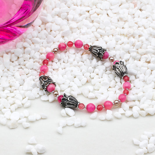 Dyed Jade Gemstones, Crystals, and Pearls, accented by electroplated metals and pewter accents.