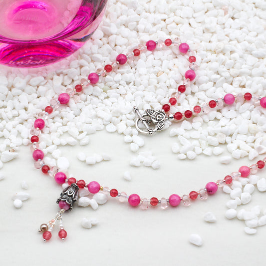 Dyed Jade Gemstones, Crystals and Pearls, this necklace captures the essence of timeless sophistication with a delicate flower focal point.