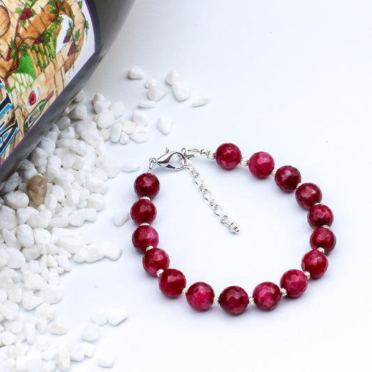 Bracelet boasts elegant Tiger Eye Jasper gemstones, silver electroplated metals, and pewter spacer beads.