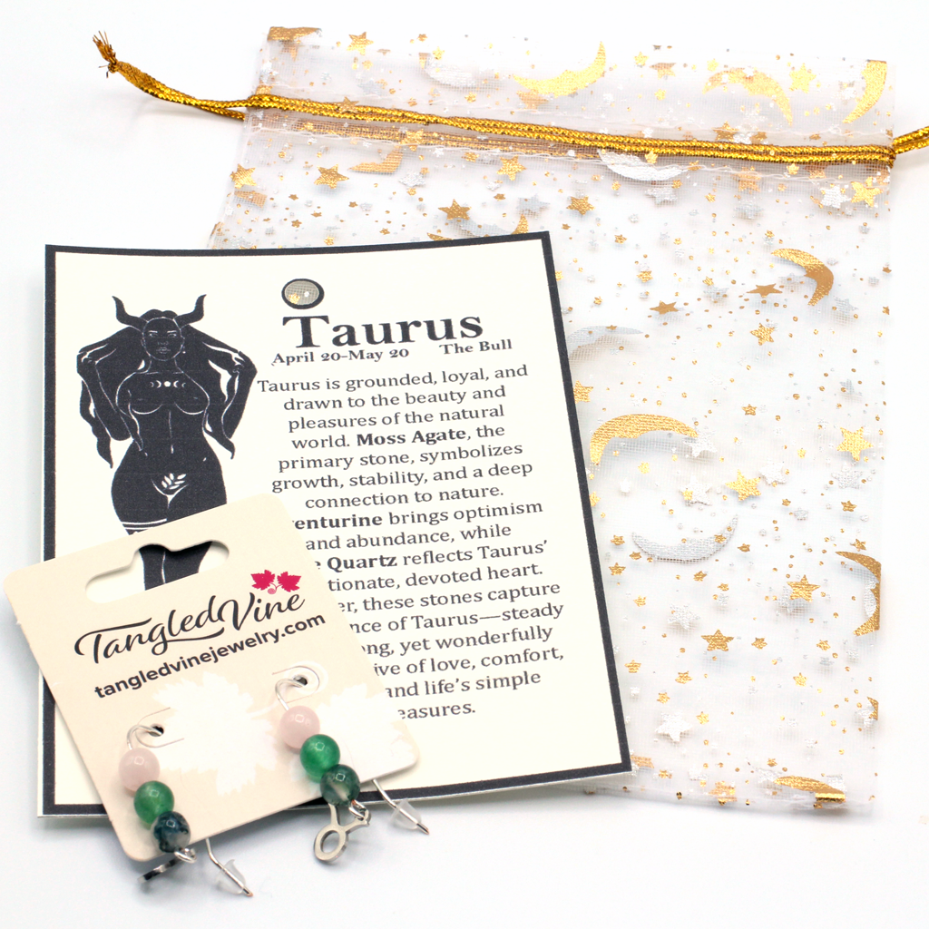 Celebrate the grounded beauty of Taurus with earrings featuring Moss Agate, Aventurine, and Rose Quartz—a gemstone trio representing growth, abundance, and love.Finished with a Taurus symbolic charm and suspended from a hand-forged earwire.