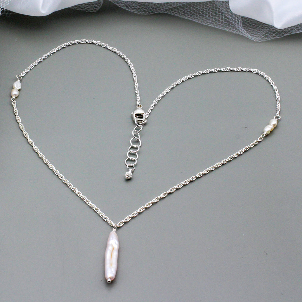 Beautiful freshwater pearls, Sterling Silver necklace features a focal freshwater pearl stick.