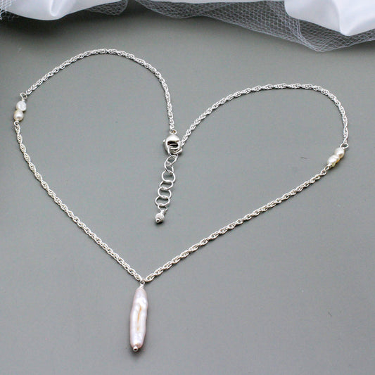 Beautiful freshwater pearls, Sterling Silver necklace features a focal freshwater pearl stick.