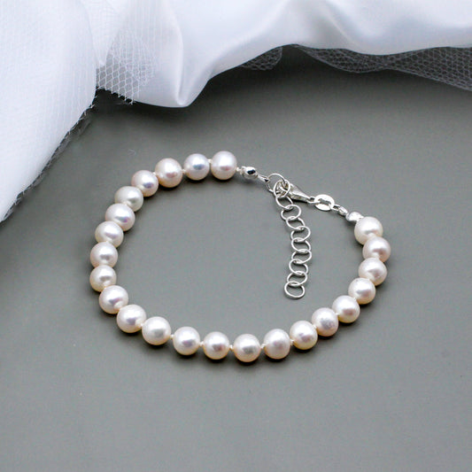 A breathtaking strand of lustrous freshwater pearls. Secured with a Sterling Silver lobster clasp and chain extender.