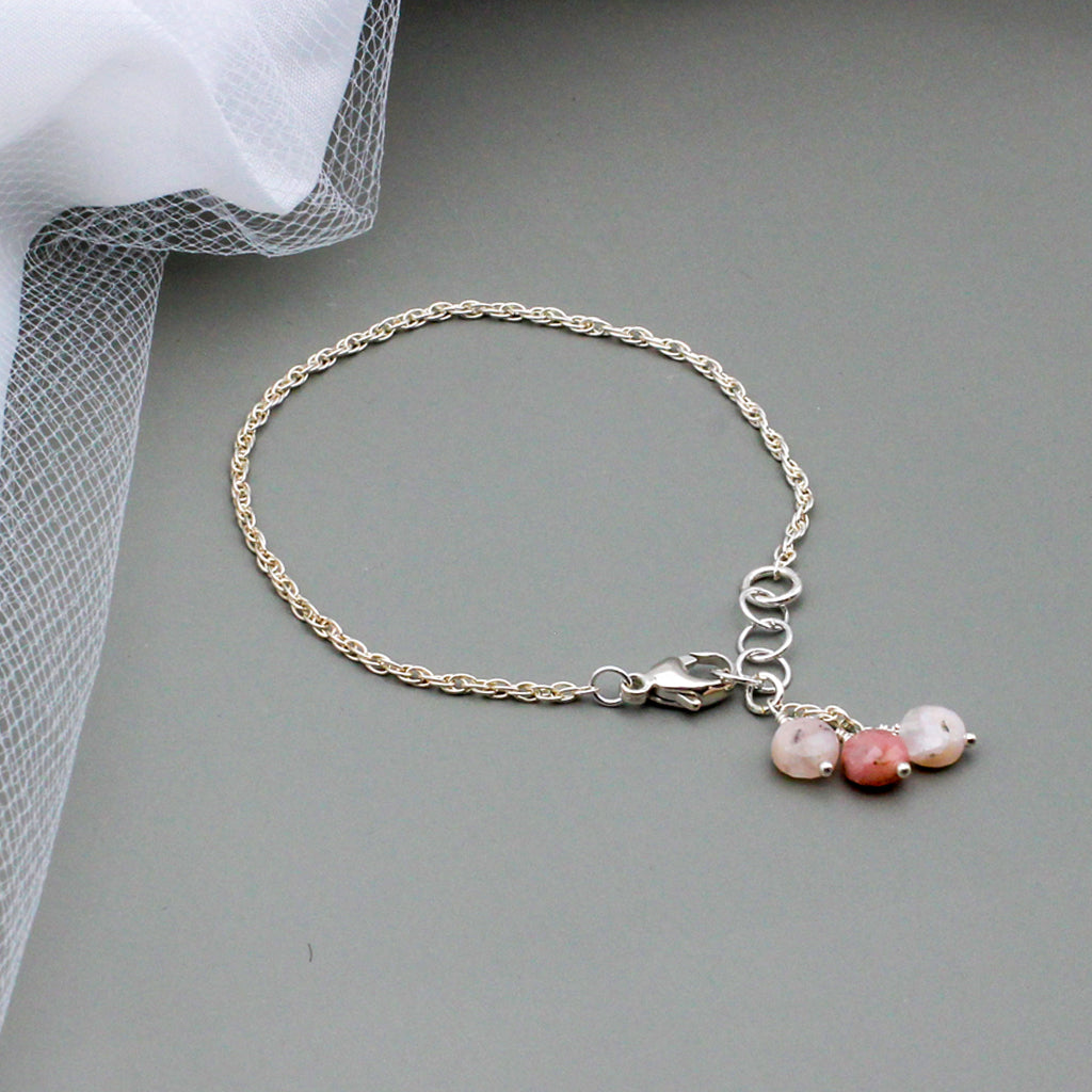 Stunning opals and sterling silver adjustable design ensures a perfect fit.