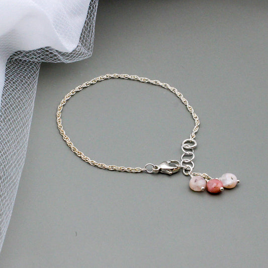 Stunning opals and sterling silver adjustable design ensures a perfect fit.