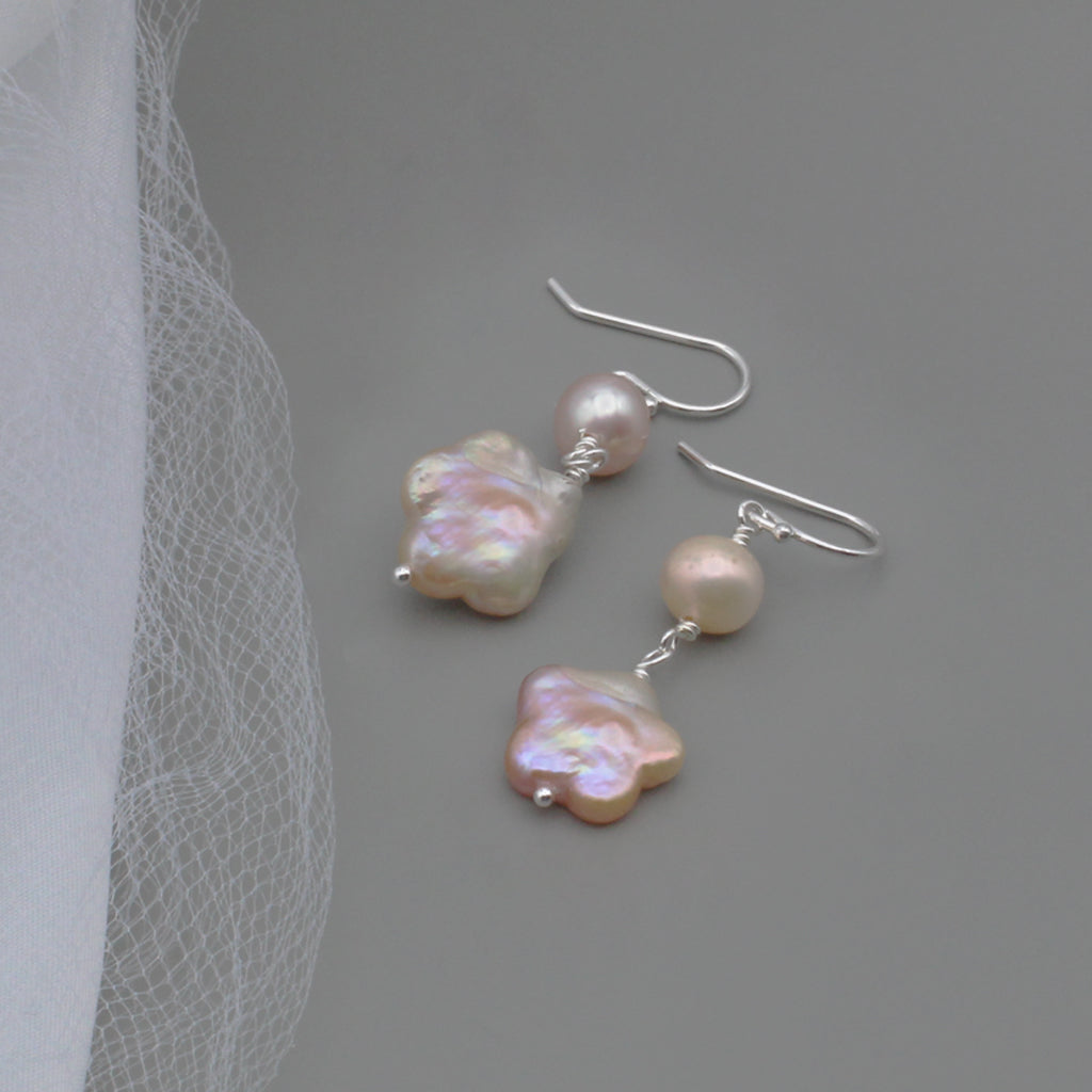 Round and intricately detailed freshwater pearls, gracefully suspended from Sterling Silver fishhook ear-wires.